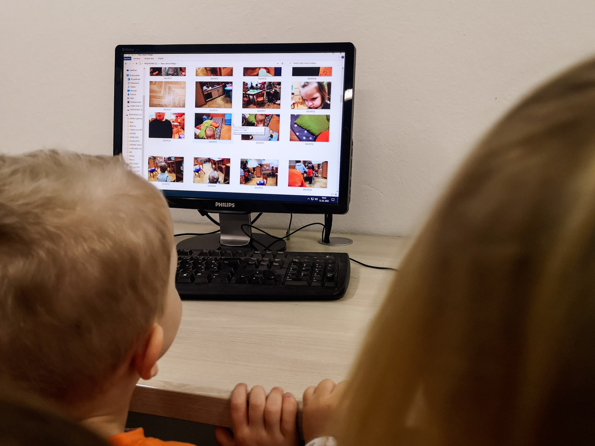 Toddlers looking at a computer screen